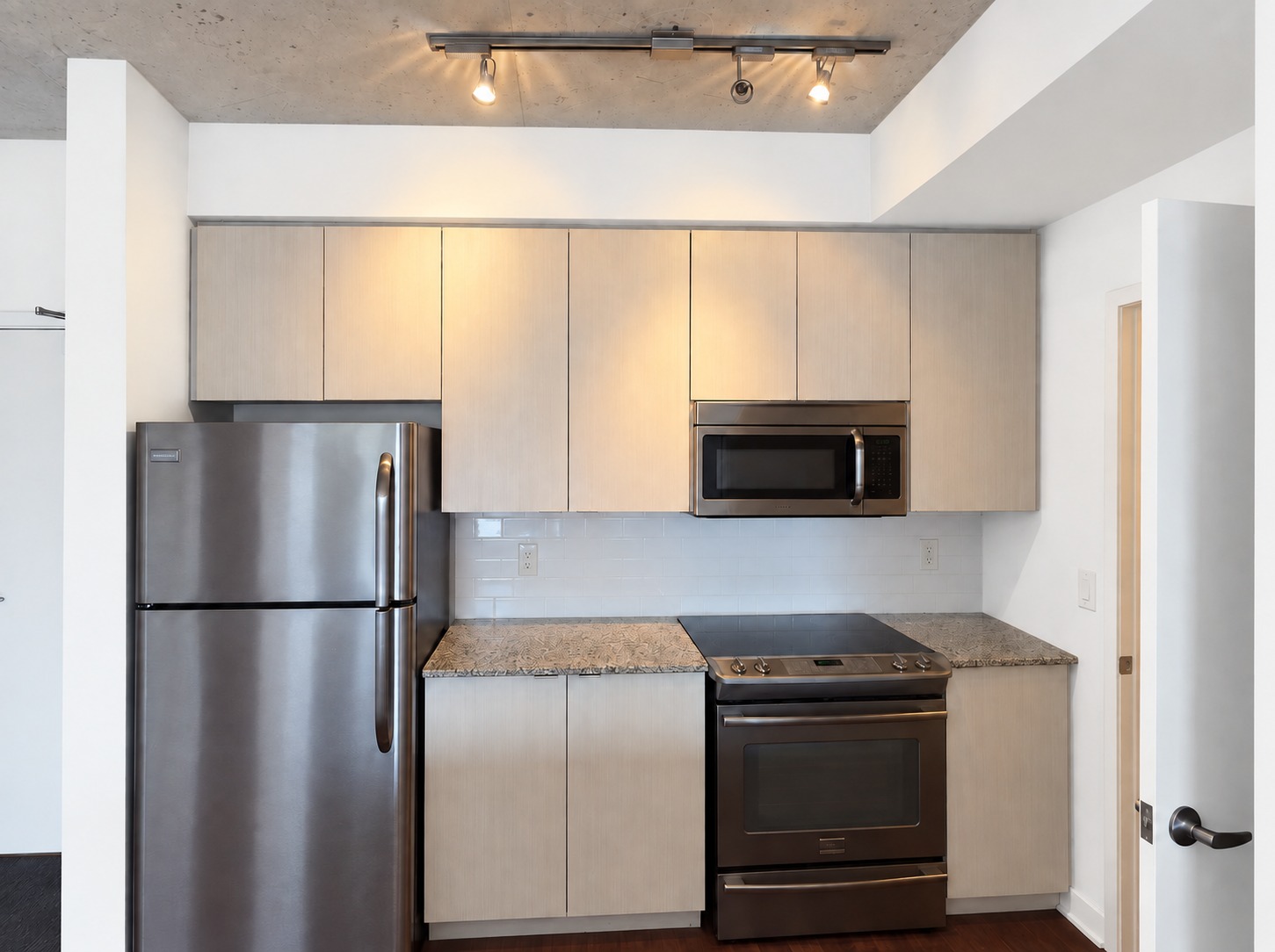 Kitchen appliances. Planned paint preview · AI visualization. Stainless refrigerator, range and microwave.