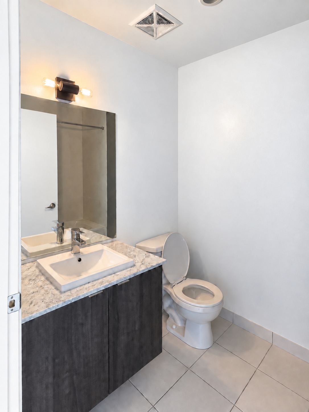 Main bathroom vanity. Planned paint preview · AI visualization. A full vanity, mirror and warm lighting.