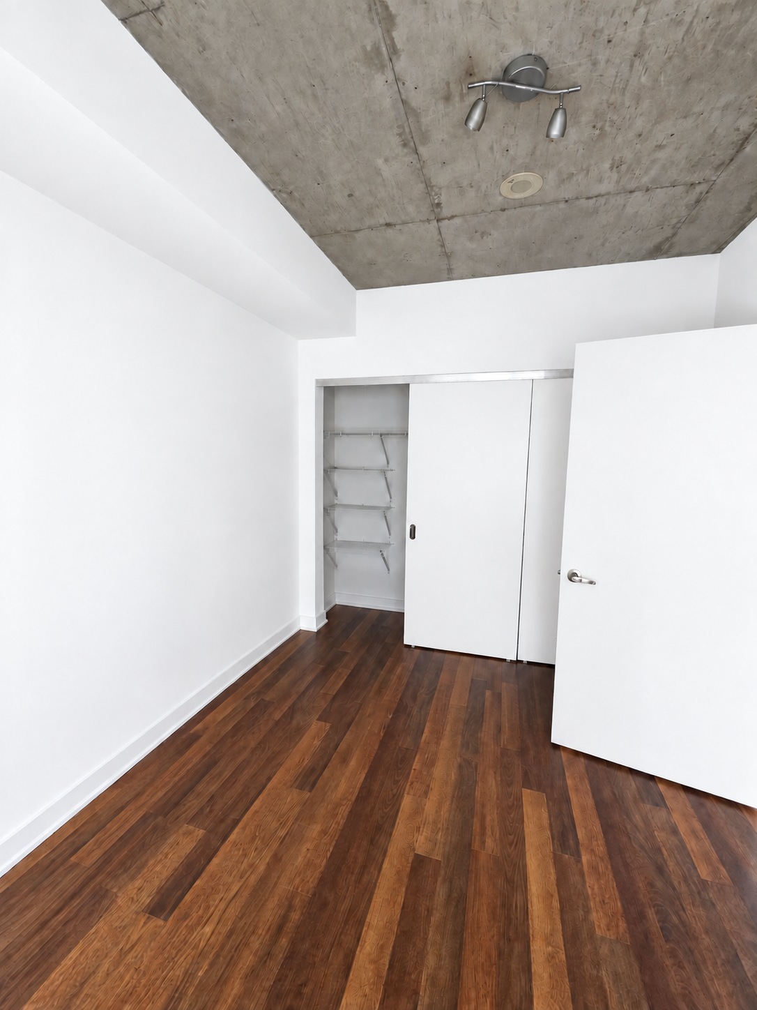 Full-wall bedroom closet. Planned paint preview · AI visualization. Full-wall sliding closet doors and shelving for everyday storage.